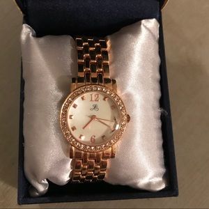 Jaclyn Smith rose gold watch.